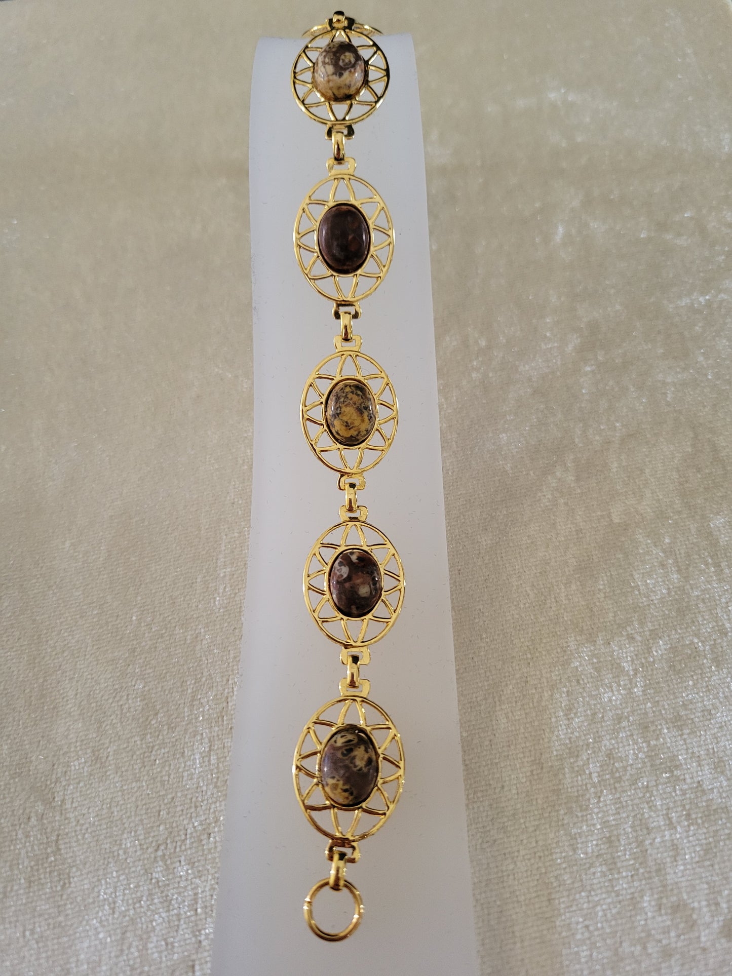 Gold tone bracelet with stone cabochons, size 7