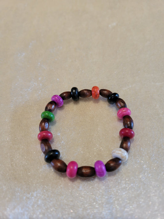 Child stretch bracelet, brown and colored wood beads, size 5