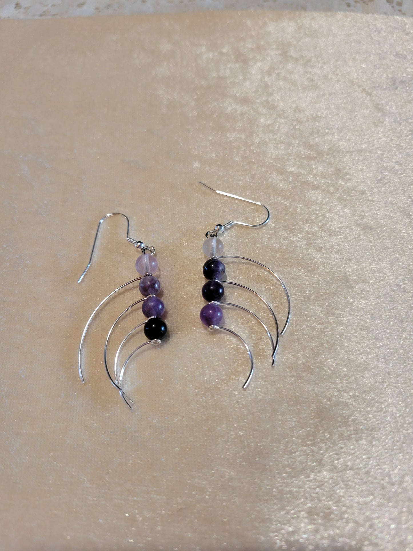 Silver tone earrings with amethyst stones