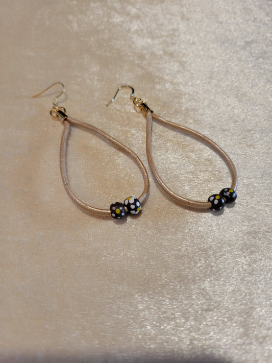 Earrings of tan leather with beads