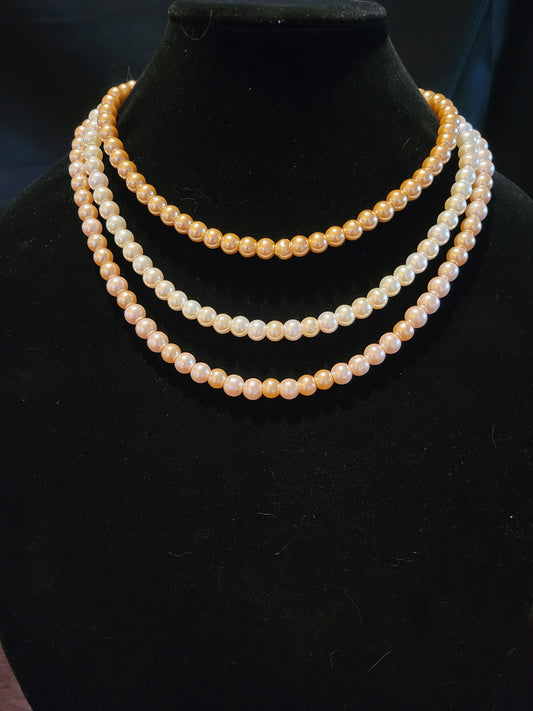 Glass pearl necklace with three strands of different colors