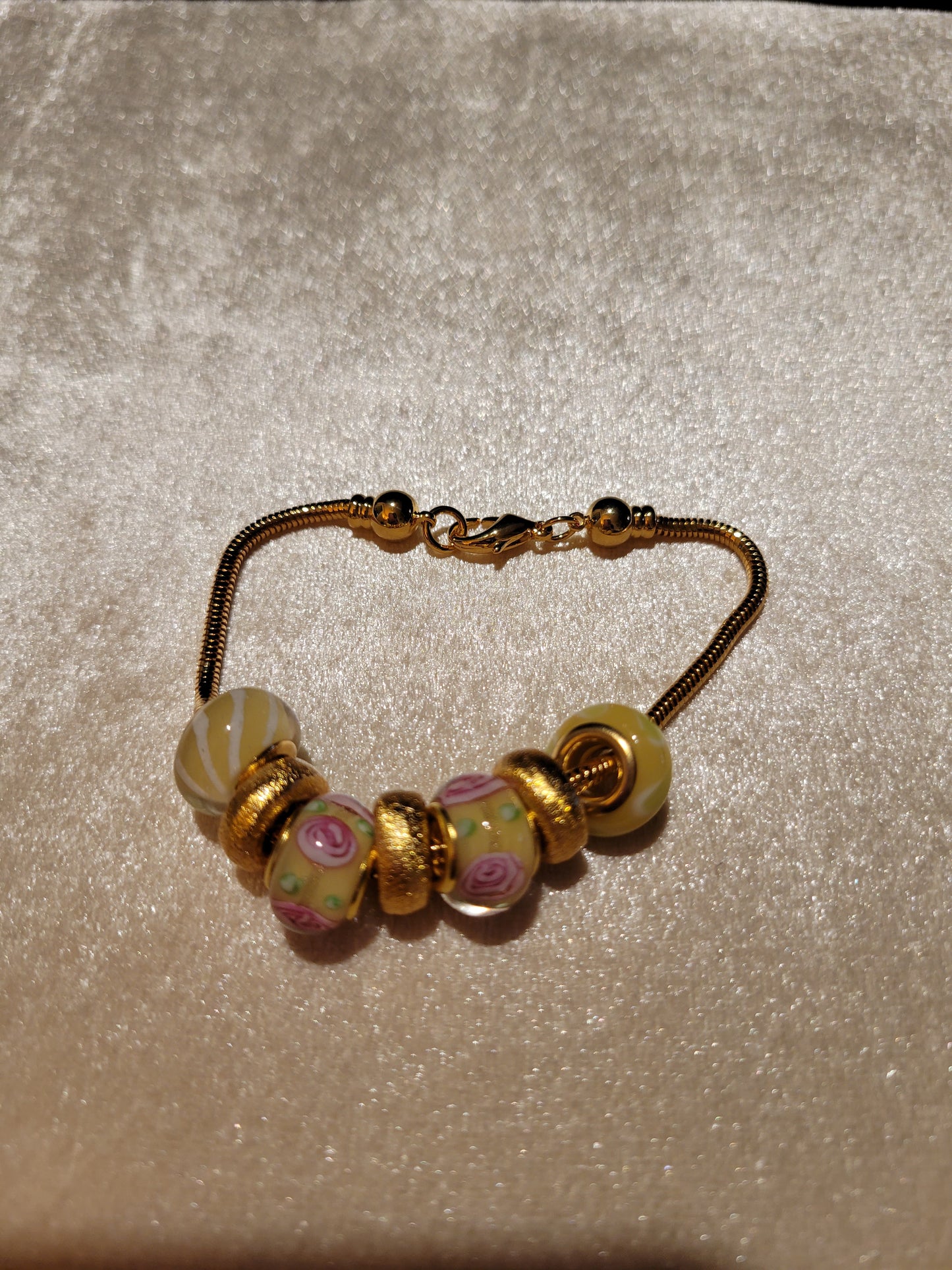 Gold Dione bracelet with pink and yellow Dione beads, size 7