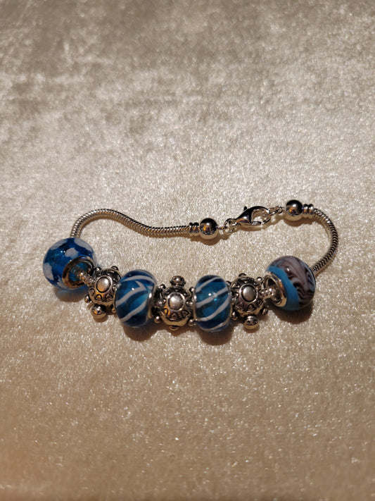 Silver tone bracelet with blue Dione beads size 7.25