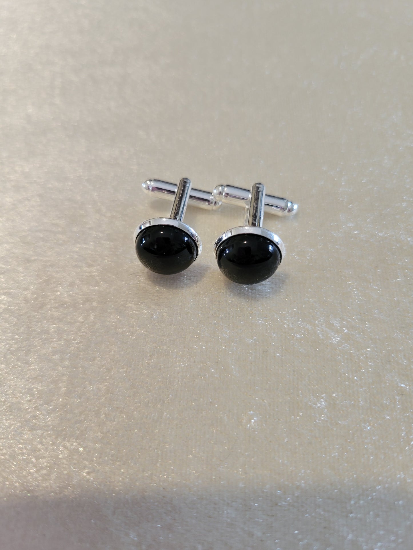 Cuff links in silver tone with black onyx